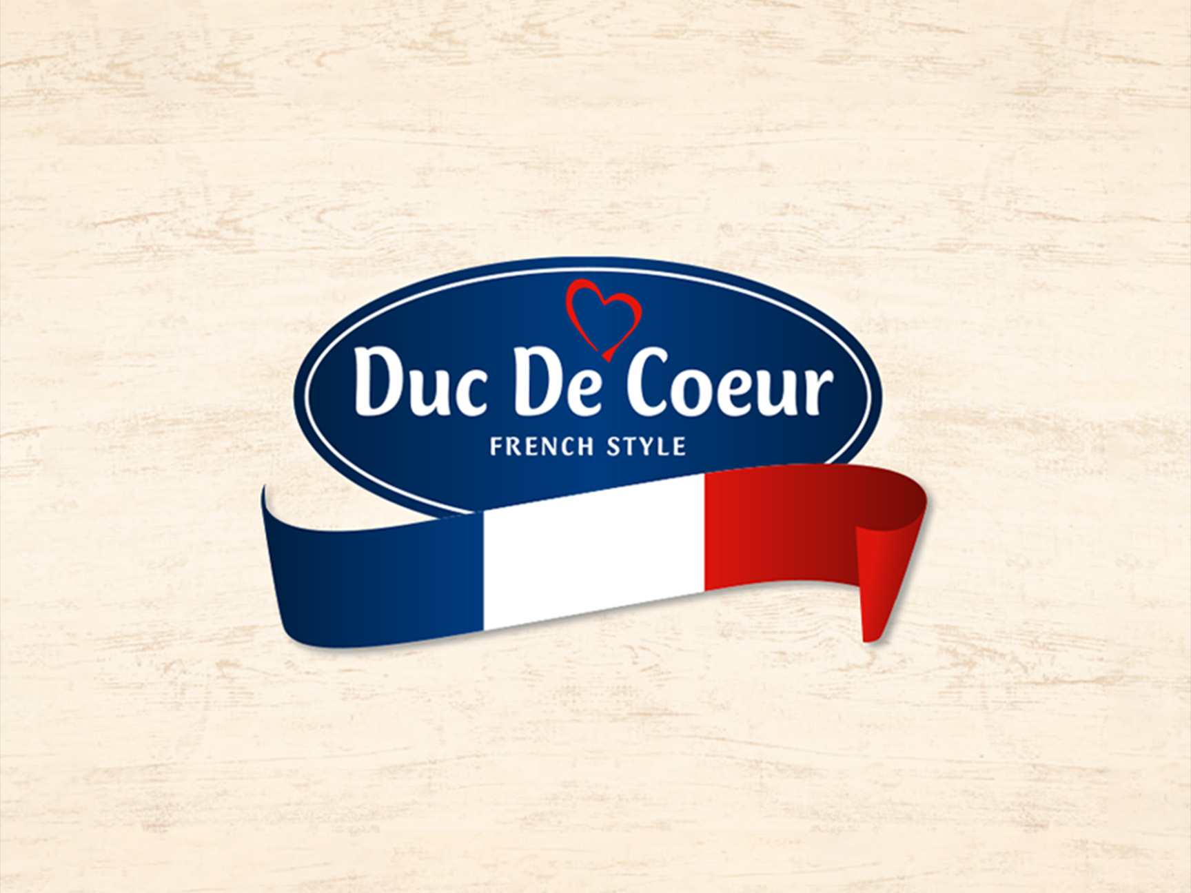 „Duc De Coeur“ logotipas su prancūziškos vėliavos juostele.