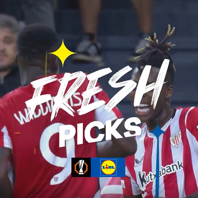 Futbolininkai raudonais ir baltais marškinėliais su užrašu „FRESH PICKS“ ir Lidl logotipu.