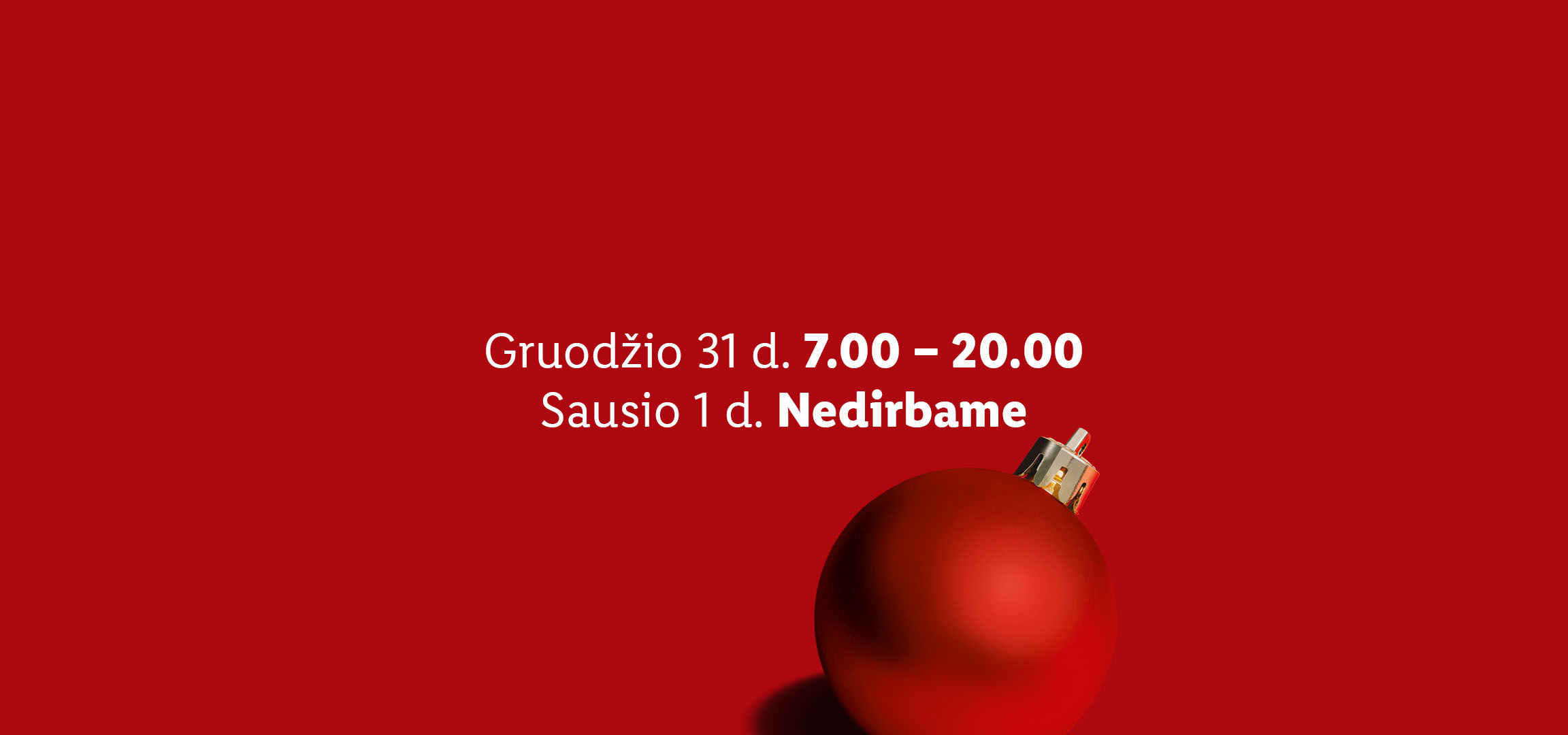 Raudonas kalėdinis burbulas su užrašu apie darbo laiką gruodžio 31 d. ir sausio 1 d.